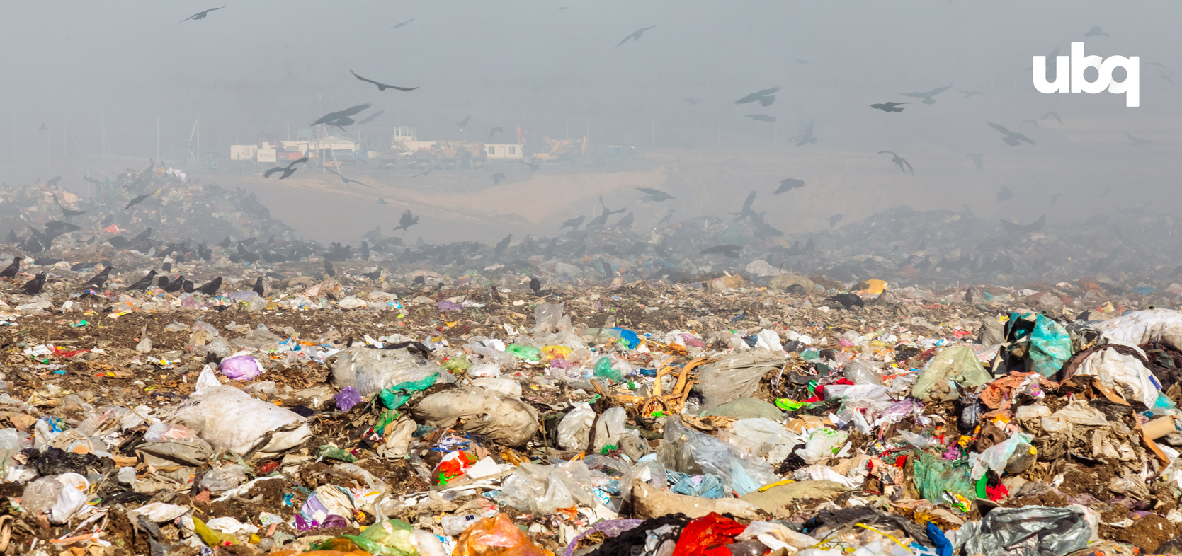 A vast landfill scene under a foggy, grey sky, filled with various types of trash, including plastic bags, bottles, and other debris. Black birds are flying above the landfill, and the UBQ logo is visible in the top right corner.